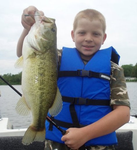 264463_10150713425385171_767110170_19717896_6112308_n[1].jpg - James, not to be outdone by his sister, shows off a huge largemouth bass!